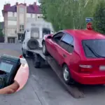 Авто на евакуаторі й алкотестер.
